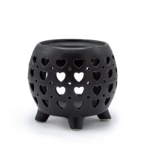 Black ceramic wax burner with heart cut-out design and raised feet