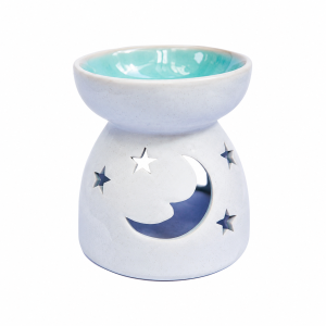 Blue ceramic moon and stars oil burner with a glossy turquoise bowl and celestial cut-out design, photographed on a clean white background. Handmade Fair Trade aromatherapy burner suitable for essential oils and wax melts.