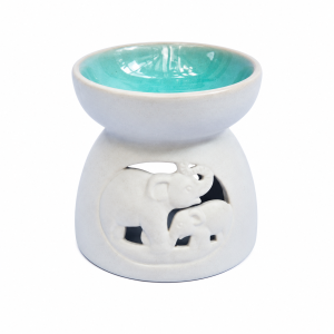 Blue ceramic elephant and baby oil burner with a glossy turquoise bowl and handcrafted cut-out design, photographed on a clean white background. Fair Trade aromatherapy burner suitable for essential oils and wax melts.